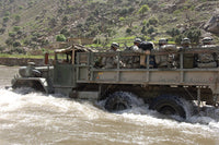 US Army soldiers fording the Pech River in Afghanistan poster print