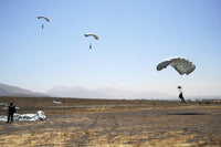 Freefall parachute jumpers poster print at the Trident drop zone in San Diego.