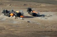 Hard Target Penetrating Bombs Exploding at Gordia Range Poster Print by Stocktrek Images