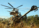 MH-53E Sea Stallion helicopter lifting M777 Howitzer poster print.