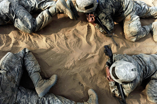 Poster print of basic trainees crawling through a tactical course