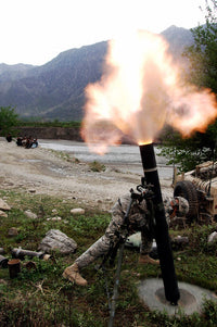US Army soldier ducking from mortar blast in Afghanistan poster print.