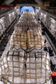 C-17 Globemaster III loading humanitarian aid supplies by Hawaii Air National Guard