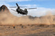 A CH-47 Chinook helicopter preparing to land poster print