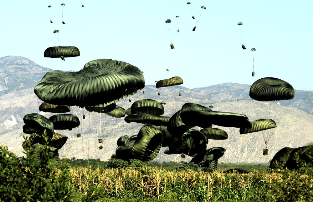 Bundles of food and water air delivery poster print depicting humanitarian efforts in Port-au-Prince, Haiti.