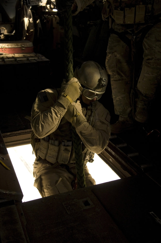 U.S. Air Force pararescueman descending from CH-53E Super Stallion poster print.