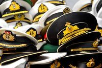Hats from Around the World poster print showcasing diverse cultural hats on a table.