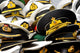 Hats from Around the World poster print showcasing diverse cultural hats on a table.