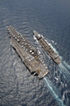 Aerial view of USS Ronald Reagan and USNS Bridge during replenishment at sea poster print.