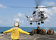 Sailors attaching a cargo pennant to an SA-330J Puma helicopter aboard USS Denver poster print.