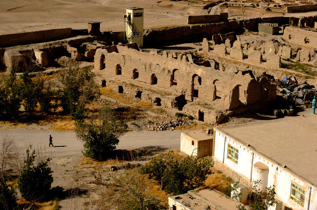 Afghan National Army soldier walking near Alexander the Great's Castle ruins in Afghanistan