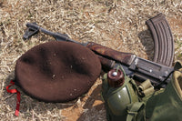Poster print of a Mozambican soldier with rifle, military cover, and canteen.