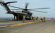 US Marines preparing to board CH-53E Super Stallion helicopter poster print.