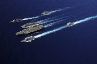 The Abraham Lincoln Carrier Strike Group ships in formation in the Pacific Ocean poster print