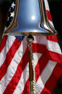 Ceremonial ships bell displayed during a dedication ceremony poster print.