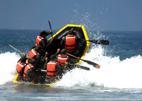 Basic Underwater Demolition SEAL students poster print featuring trainees battling through the surf