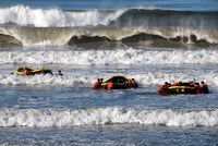 Basic Underwater Demolition/SEAL students participating in surf passage training exercise poster print.