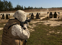 Rifle Qualification Training Poster at Fort Bragg featuring a military policeman.