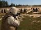 Rifle Qualification Training Poster at Fort Bragg featuring a military policeman.