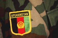 Close-up view of a patch on a soldier's uniform poster print