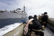 Mock drill print of members of the visit, board, search and seizure team approaching their ship.