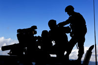 Silhouette of soldiers operating BGM-71 TOW guided missile system poster print.