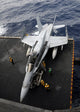 Sailors moving an F/A-18C Hornet into the hangar bay poster print