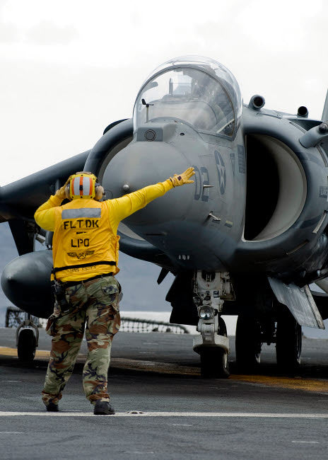 Aviation Boatswain's Mate directing pilot of AV-8B Harrier II Poster Print