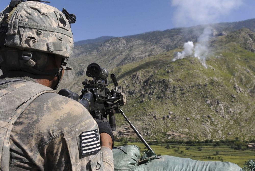 U.S. Army grenadier scanning ridgeline from observation post in Afghanistan poster print.