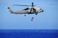 SH-60F Sea Hawk helicopter search and rescue swimmer poster print.