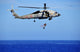 SH-60F Sea Hawk helicopter search and rescue swimmer poster print.