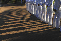 Sailors Stand at Parade Rest Poster Print showcasing military ceremony