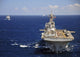 USS Boxer leads a convoy of ships in the Indian Ocean poster print.