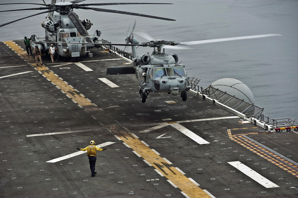 MH-60S Sea Hawk landing aboard USS Makin Island poster print.
