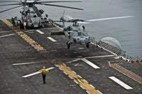 MH-60S Sea Hawk landing aboard USS Makin Island poster print.