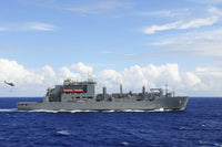 MH-60S Sea Hawk preparing to drop supplies onto USNS Charles Drew poster print.