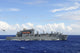 MH-60S Sea Hawk preparing to drop supplies onto USNS Charles Drew poster print.