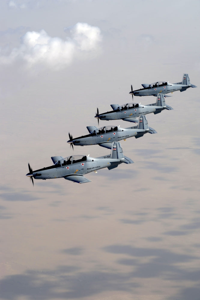 Iraqi Air Force T-6 Texan trainer aircraft poster print over Tikrit.