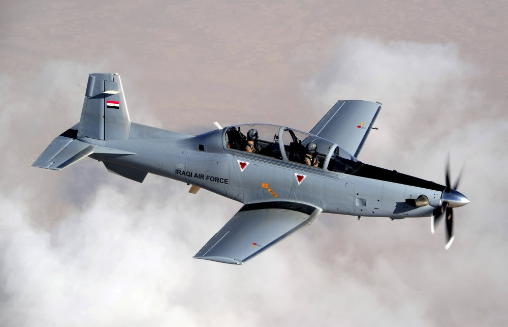Iraqi Air Force T-6 Texan trainer aircraft poster print over Tikrit.