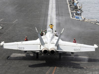 EA-18G Growler Poster Print featuring sailors performing pre-launch checks