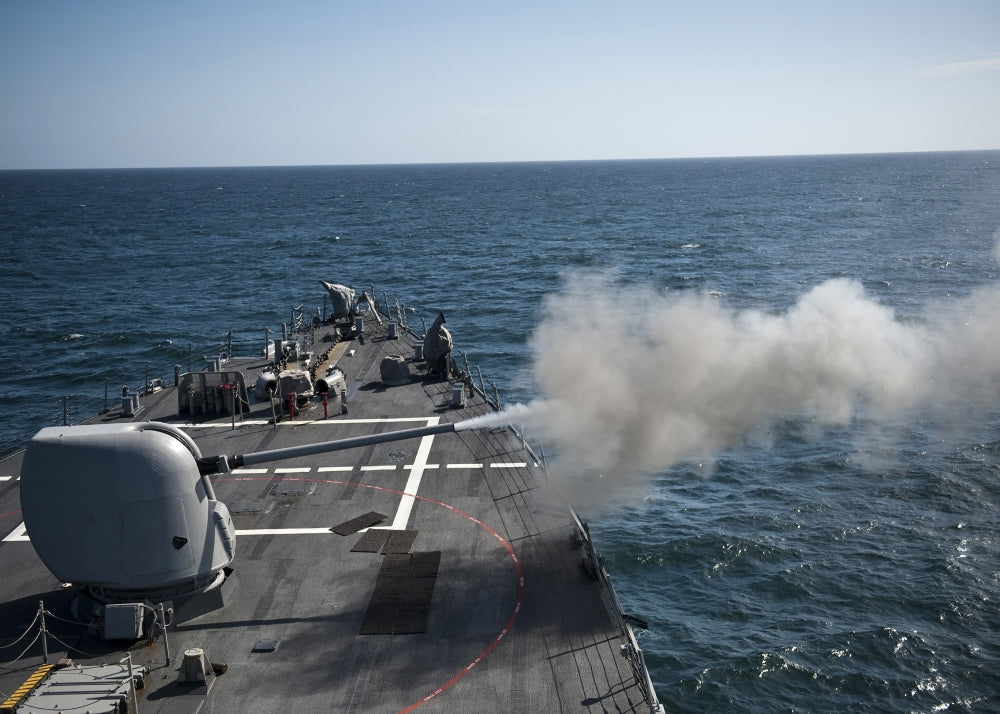 Mk-45 lightweight gun firing aboard USS Arleigh Burke poster print