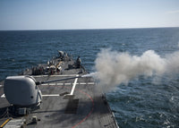 Mk-45 lightweight gun firing aboard USS Arleigh Burke poster print