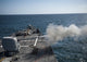 Mk-45 lightweight gun firing aboard USS Arleigh Burke poster print