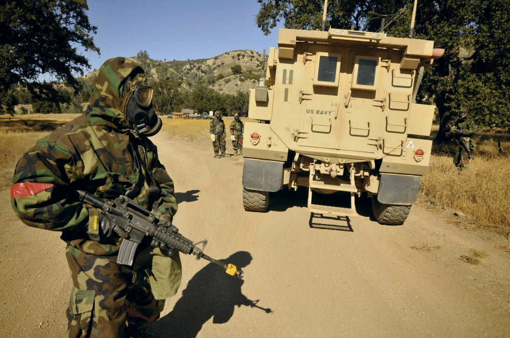 Seabees conduct a wash down of a suspicious vehicle poster print.