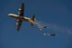 C-130 Hercules Airdrop Poster Print showcasing military aviation over Afghanistan.