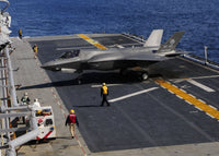 F-35B Lightning II performing a vertical landing on USS Wasp poster print.