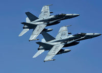 Two F/A-18C Hornets in flight poster print showcasing military aircraft in action.