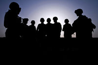 Poster print of U.S. Marines and civilian contractors gathering for a briefing.