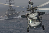MH-60S Knight Hawk delivering supplies to USS Carl Vinson poster print