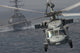 MH-60S Knight Hawk delivering supplies to USS Carl Vinson poster print